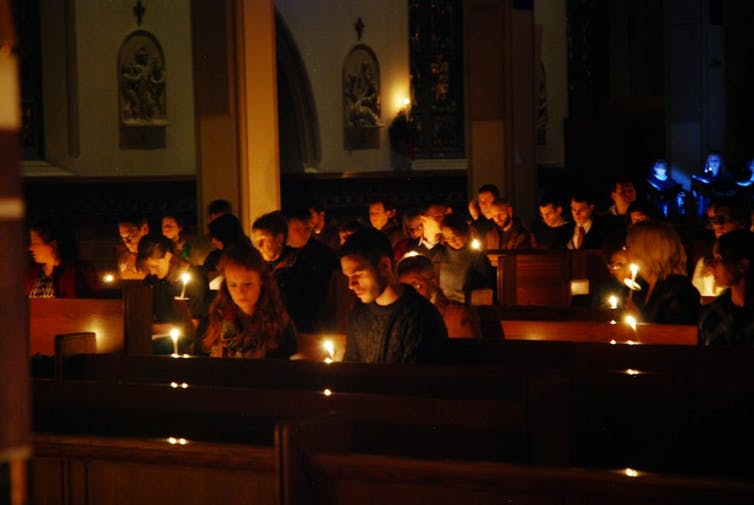Religious people With Candles In Church