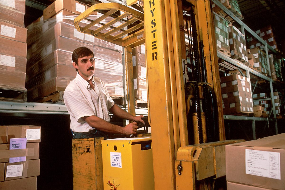 Man Operating A Forklift In A Warehouse
